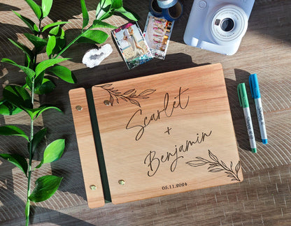 Modern welcome engraved wedding guest book open showing interior pages for signatures