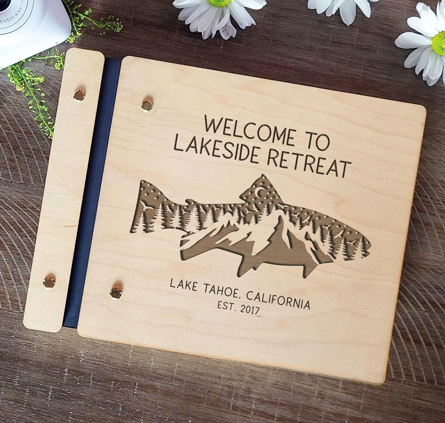 Lake house vacation rental guest book wood cover engraving close up detail