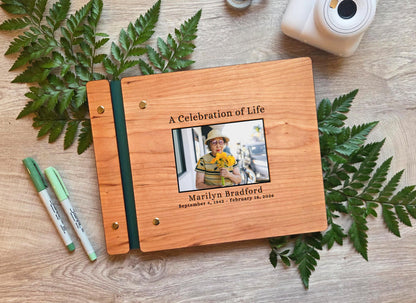 A Celebration of Life memorial guest book with color printed photo